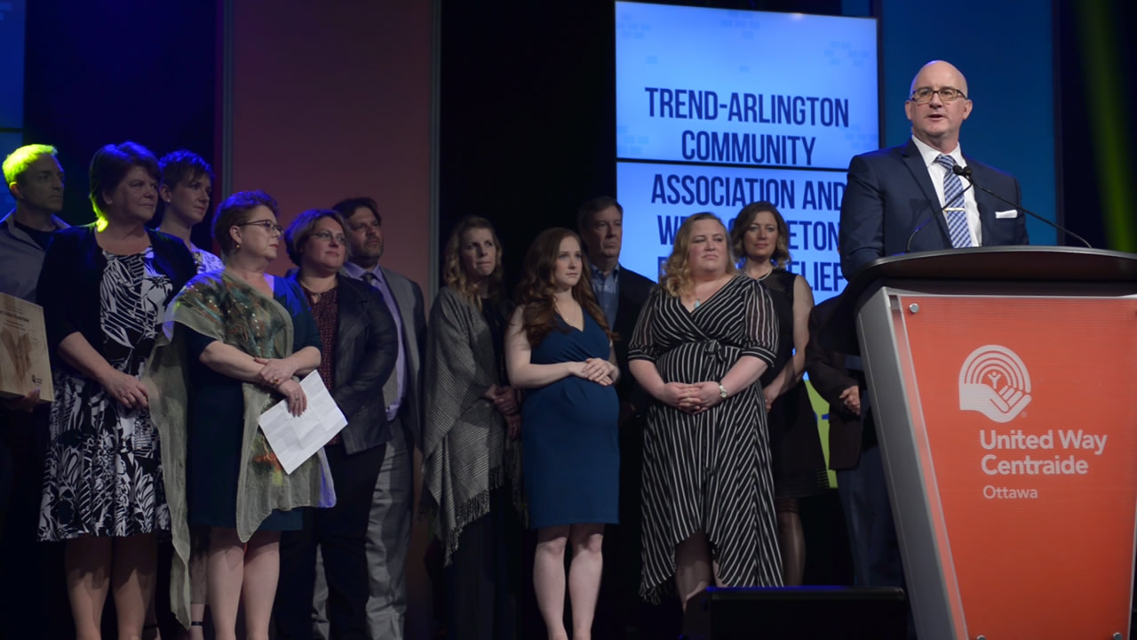 A photo of the Trend-Arlington Community Association and West Carleton Disaster Relief accepting their award at the CBYA Gala.
